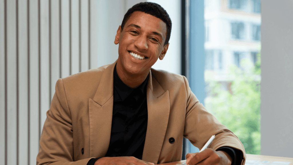 Bookkeeper working on a laptop with financial documents